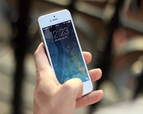 Smartphone displaying the fictional Crown Reef Guardians ocean strategy game